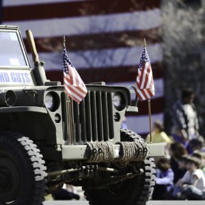 Jeep in front of Flag