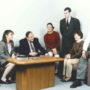 Employees Sitting Around a Table