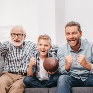 Family watching football at home