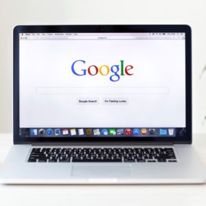 MacBook Pro Retina with Google home page on the screen